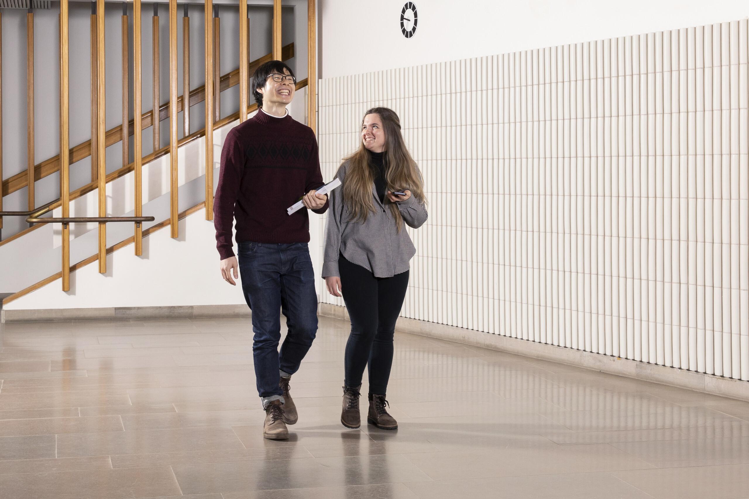 Two people walking.